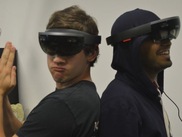 Greg and Aakash wearing the HoloLens in style