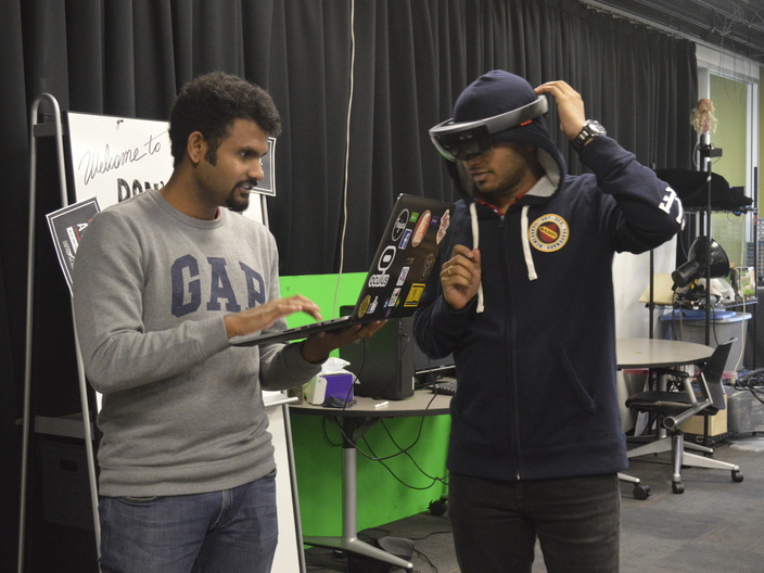 Chinmay and Aakash developing our HoloLens prototype in the MxR Lab.