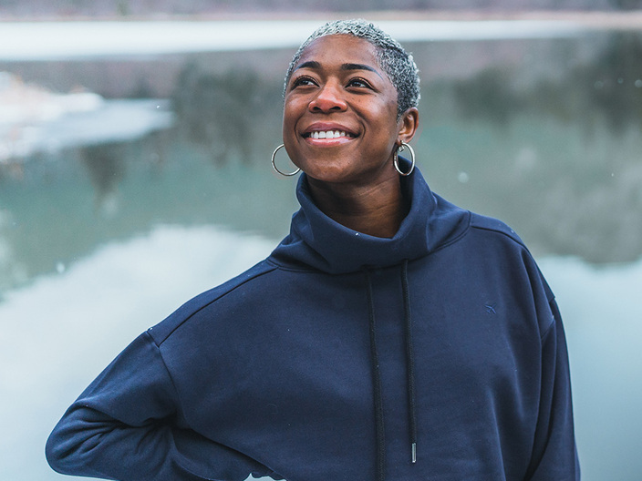 Woman wearing NxTSTOP cropped sweatshirt