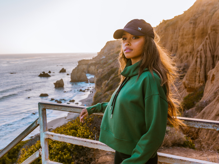 Woman wearing NxTSTOP cropped sweatshirt