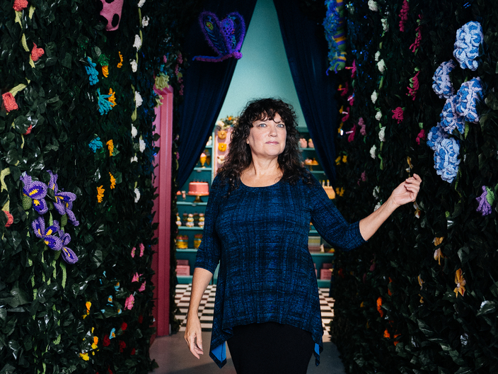 Sally Ackerman, Co-founder of the Dallas Yarn Bombers, inside her Sweet Tooth Hotel Intangible Installation. 