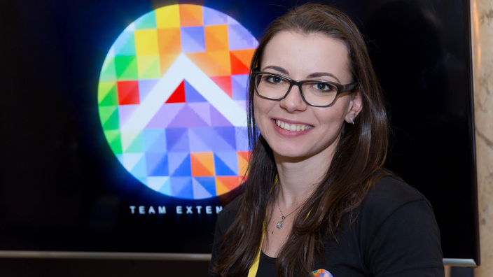 © 2017 - Team Extension - Sales Specialist in front of Team Extension Logo at the Bucharest Technology Week - Bucharest, Romania