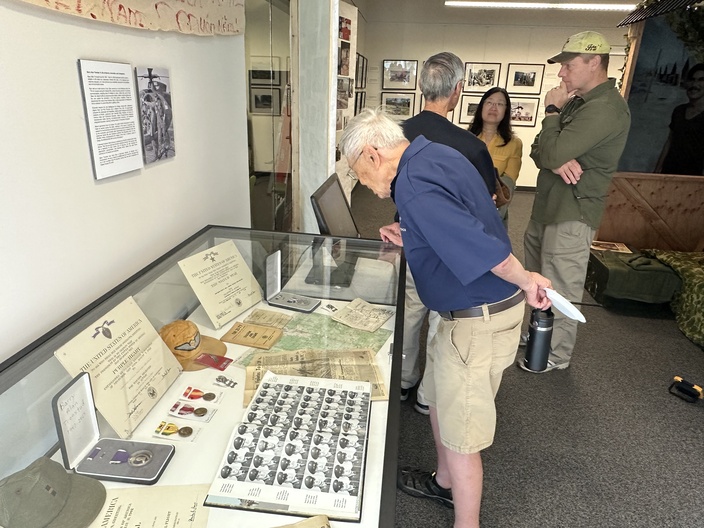 An exhibit display case photographed during the Grand Opening of We Remember: From Ventura County to Vietnam and Back on March 29, 2025. The case features memorabilia from Army Helicopter Pilot Barry A. Tronstan, a Purple Heart recipient and decorated veteran recognized for his valor. Tronstan’s experiences were also briefly featured on the History Channel. The exhibit, free and open to the public, is housed at the John Spoor Broome Library at CSU Channel Islands.